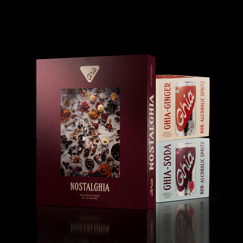 Nostalghia puzzle box beside Ghia Ginger and Ghia Soda spritz four-packs