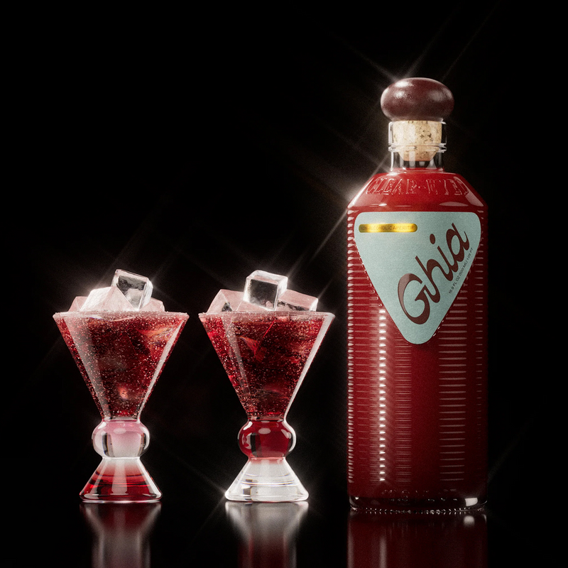 Ghia aperitif bottle beside two sculpted glasses of red spritz over ice with red and pink stems