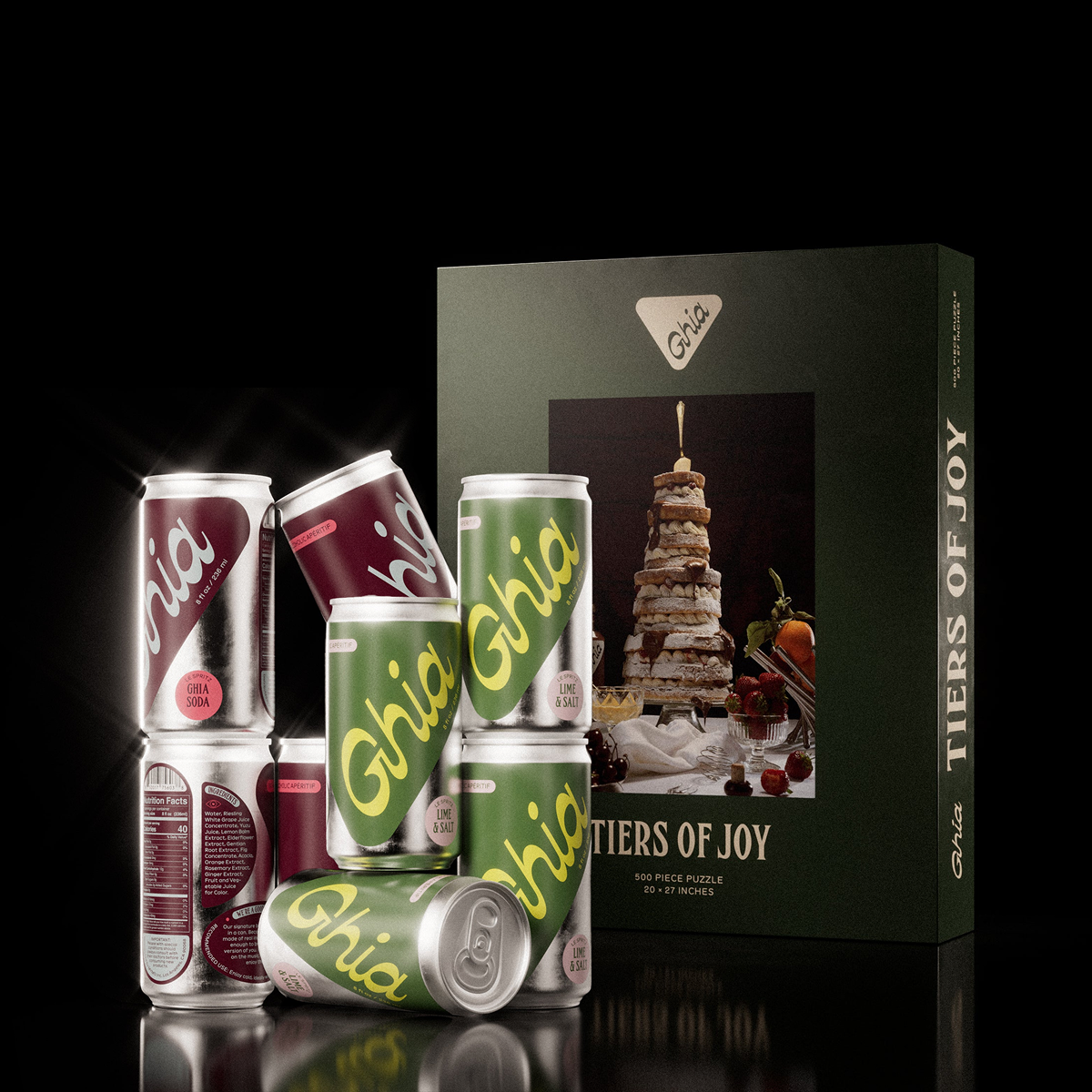 Stacked Ghia spritz cans beside the Tiers of Joy puzzle box showing a tiered sandwich cake
